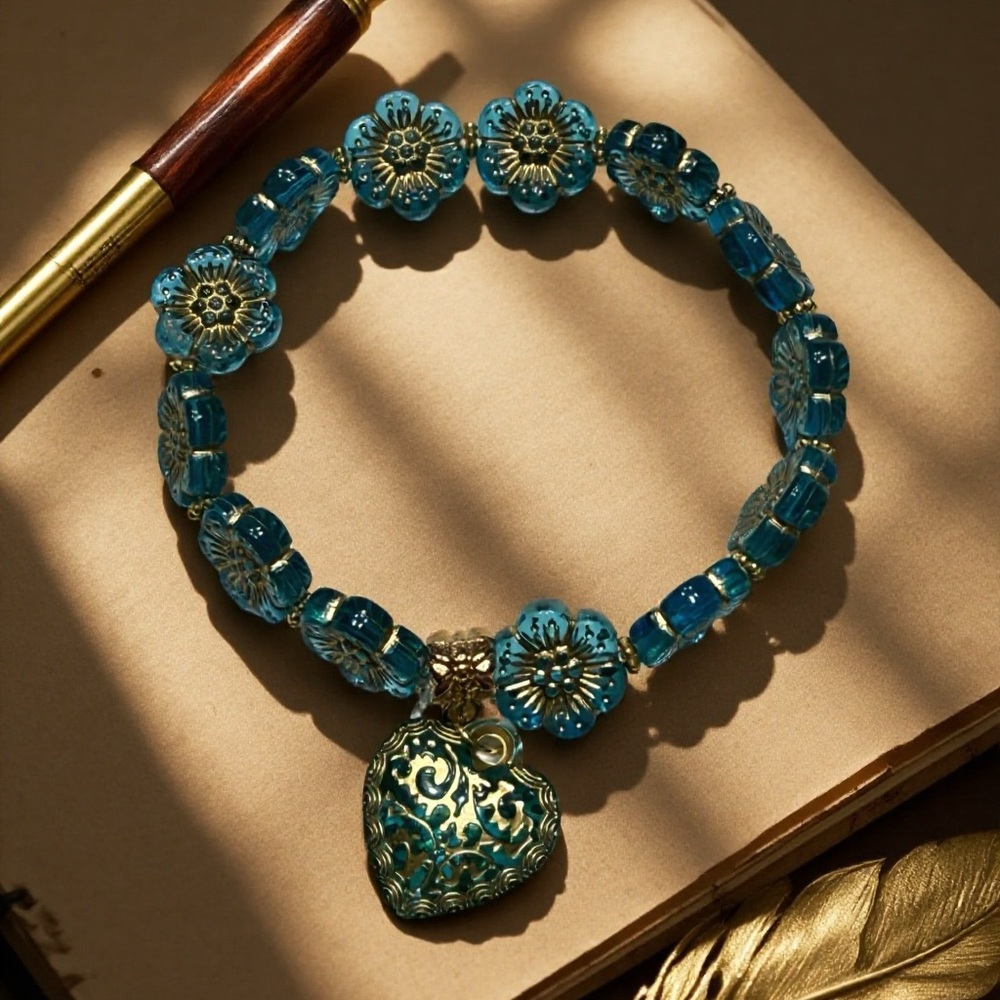 Hand Crafted Teal Flower Glass Bead Bracelet with Filigree Heart Charm - Picture 4 of 4